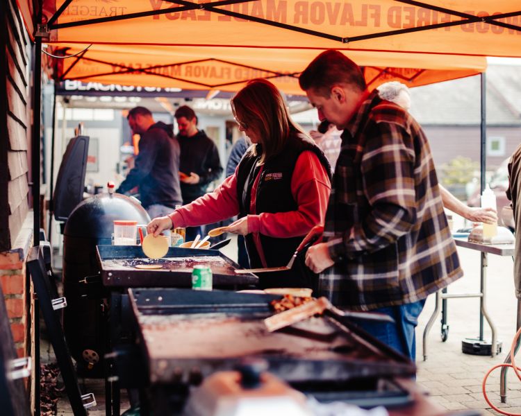 people cooking on blackstone griddle bbq on a cooking experience on how to use these bbq's