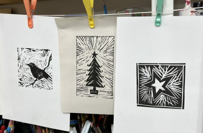 printed lino cut images hanging to dry made on a lino printing workshop