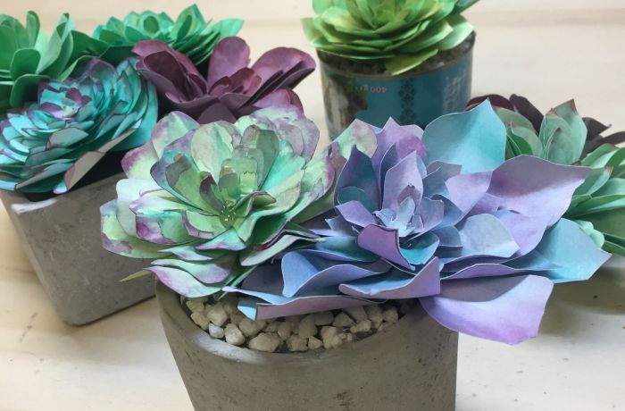 flowers made out of coloured paper on a craft workshop