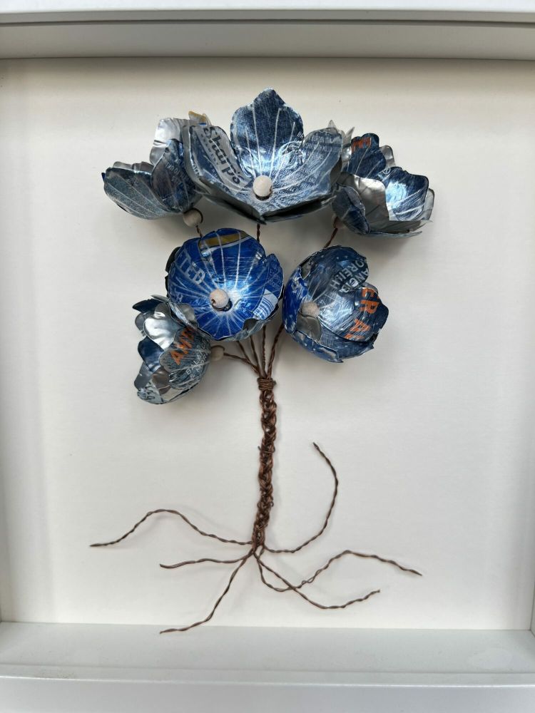 flowers made from cut up metal drinks cans