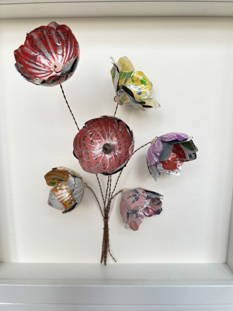 framed flowers made from cut up recycled metal drinks cans