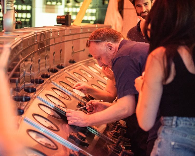 man looking at dials at escape the power cut escape room