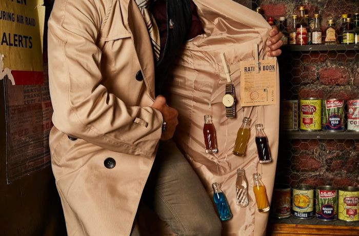 Man with bottles of alcohol hidden under coat at cahoots underground in london