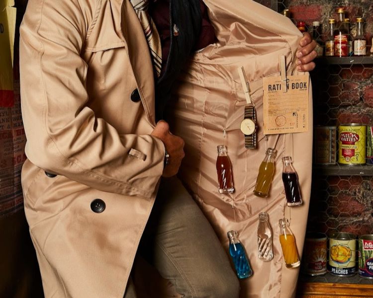 Man with bottles of alcohol hidden under coat at cahoots underground in london