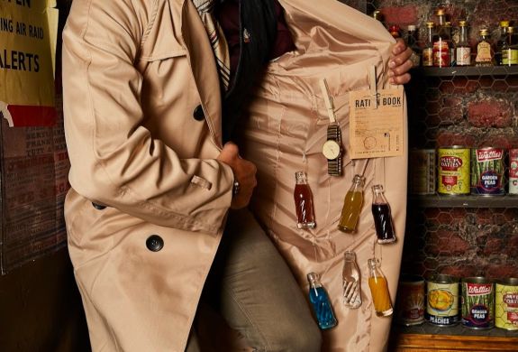 Man with bottles of alcohol hidden under coat at cahoots underground in london