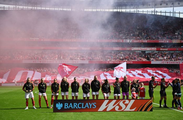 arsenal womens team lined up on pitch before match