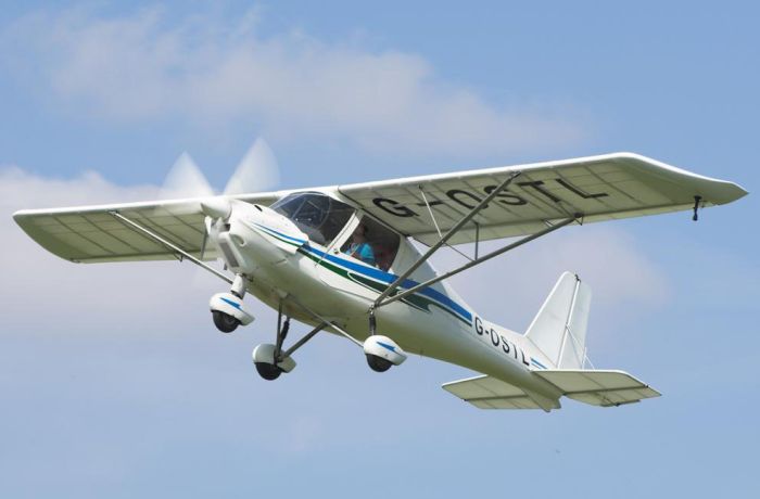 microlight in the sky flying from goodwood aerodrome