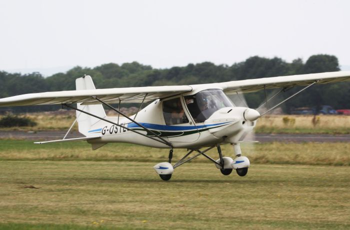 microlight taking off from goodwood aerodrome