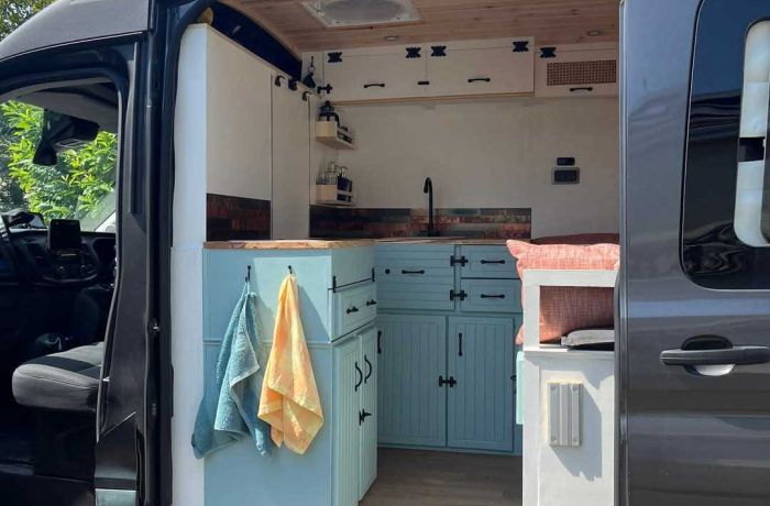 campervan with door open to see the conversion inside
