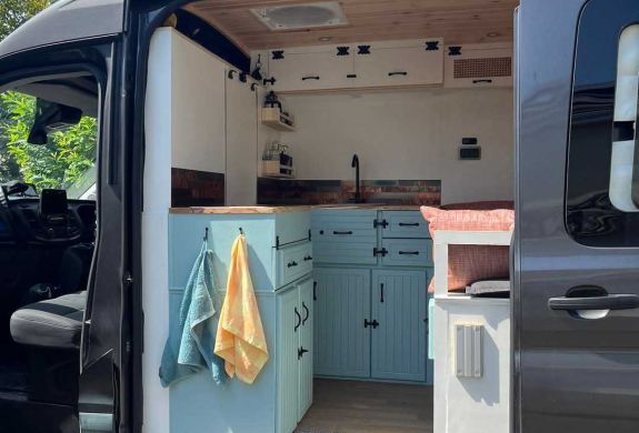 campervan with door open to see the conversion inside