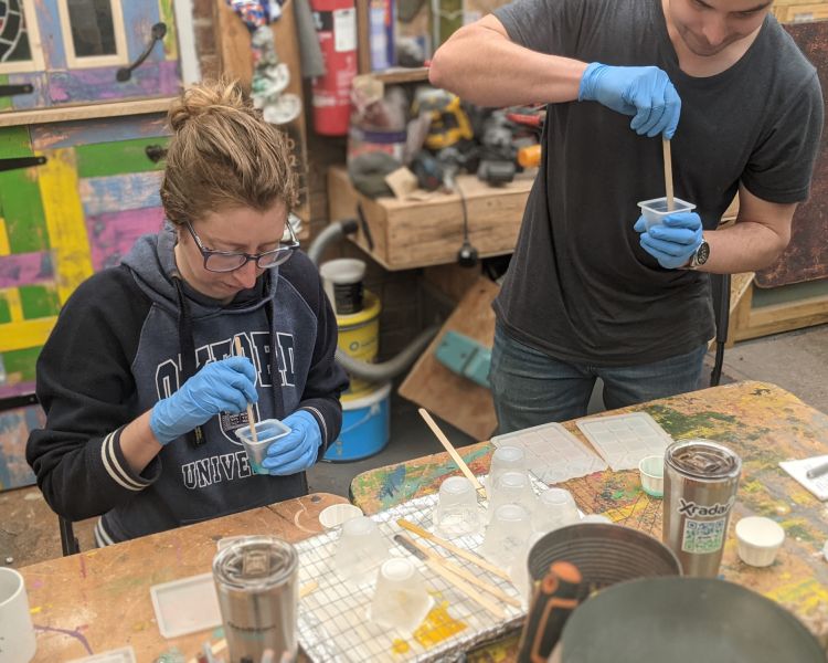 man and woman mixing resin on a resin art workshop in somerset