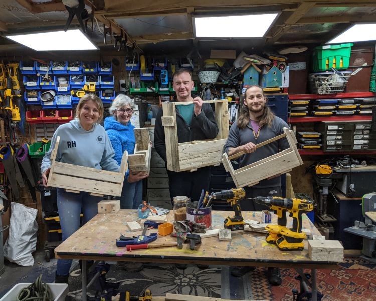 group with their items made from wooden pallets