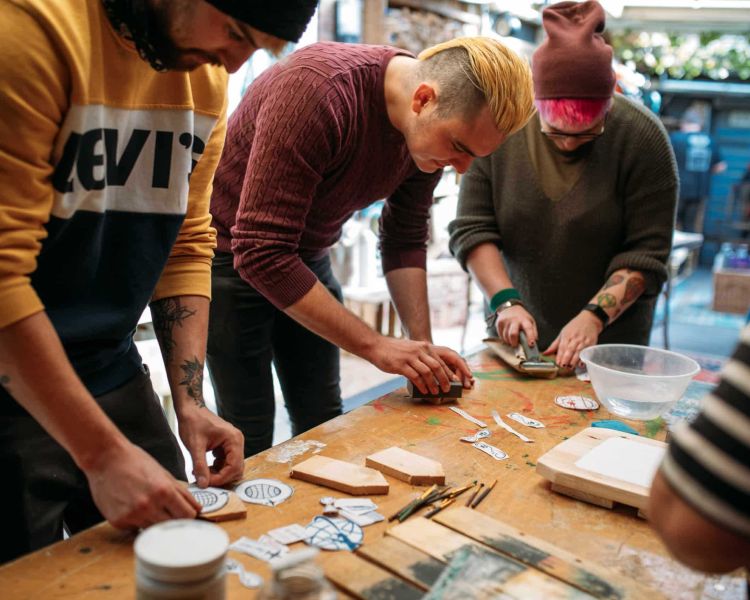 People working on image transfers on decoupage craft course