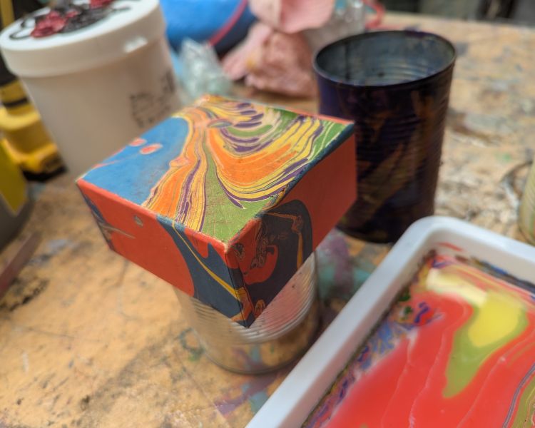 box covered in water marbling pattern