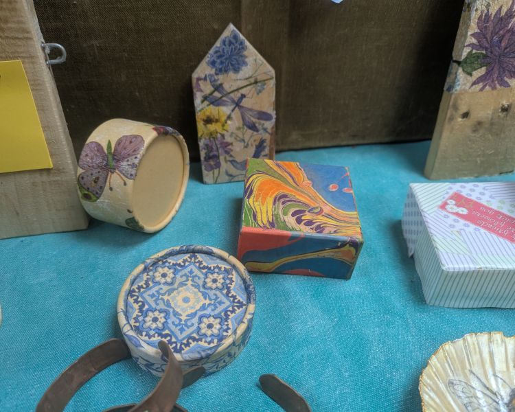 selection of decorative items covered in decoupage and water marbling