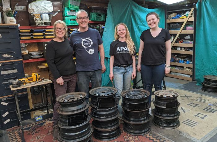 group with their hand made fire pits made on a one day course