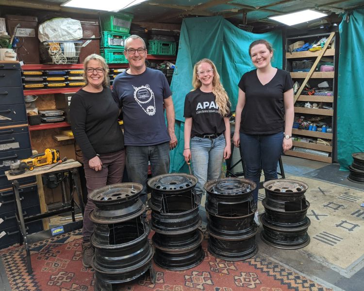 group with their hand made fire pits made on a one day course
