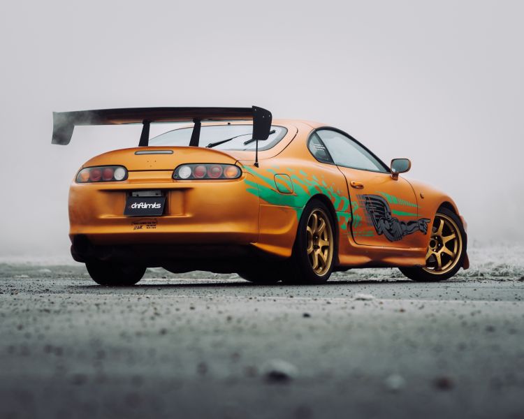 Rear view of fast and furious toyota supra on track