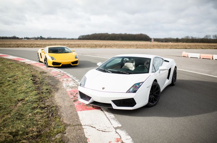 White and yellow lambirghini gallardo supercars on track