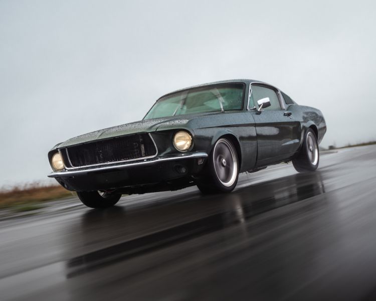 Front view of black ford mustang bullitt on track