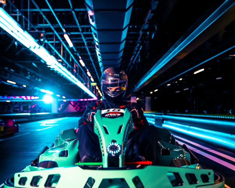 Man in f1 drive kart on track