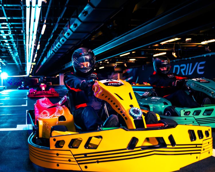 People in karts on track at f1 drive london