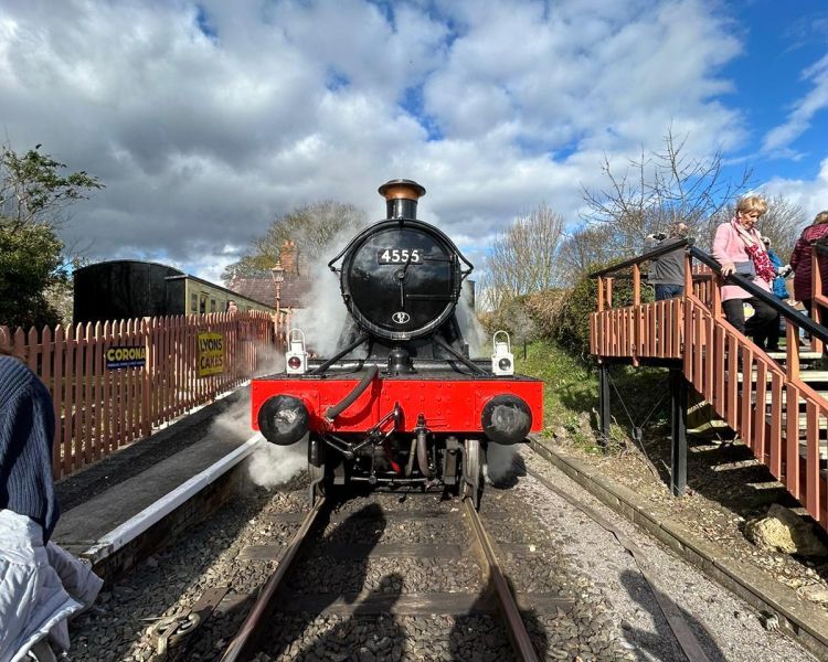 Front of a steam train at platform