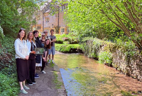 Group on father brown locations tour near village stream