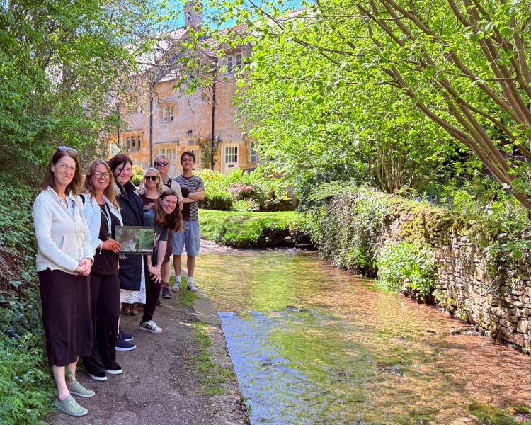 Group on father brown locations tour near village stream