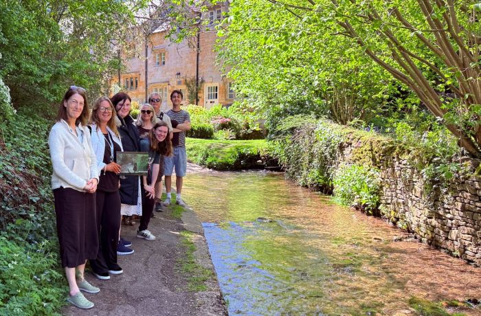 Group on father brown locations tour near village stream
