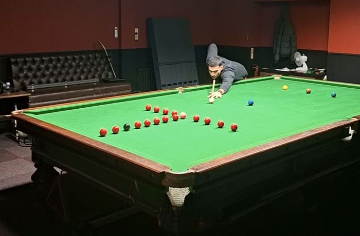 man at snooker table showing shot for snooker pool masterclass in london