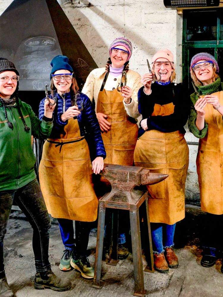 Group holding coat hooks made on blacksmith experience