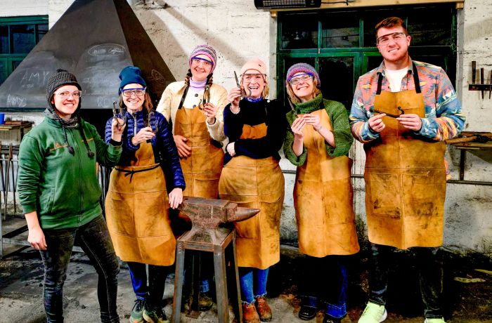 Group holding coat hooks made on blacksmith experience