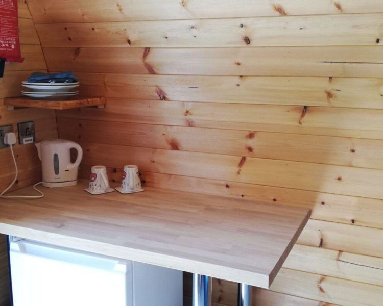 Fridge and breakfast bar in premium pod