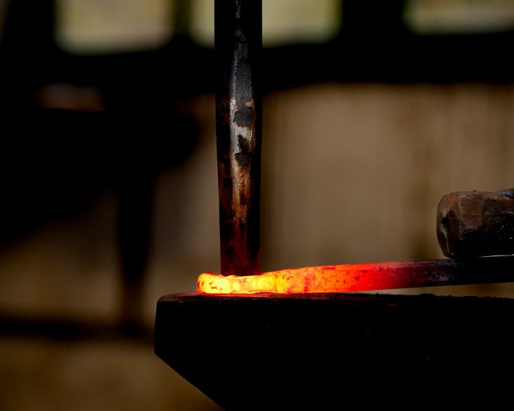 hot metal being hammered on a blacksmith day experience