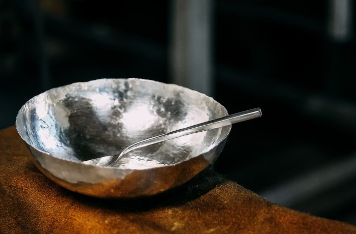 a copper bowl and spoon plated in silver made on a silversmith day course