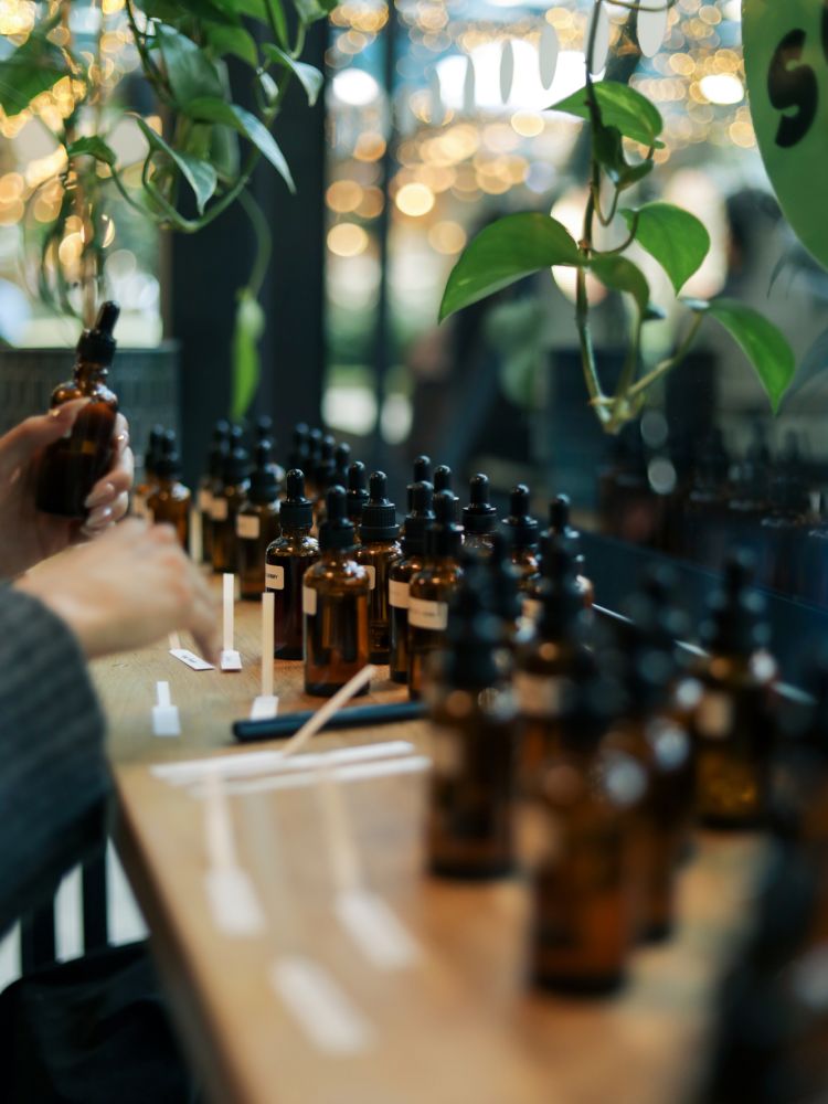 Fragrance oils lined up by window