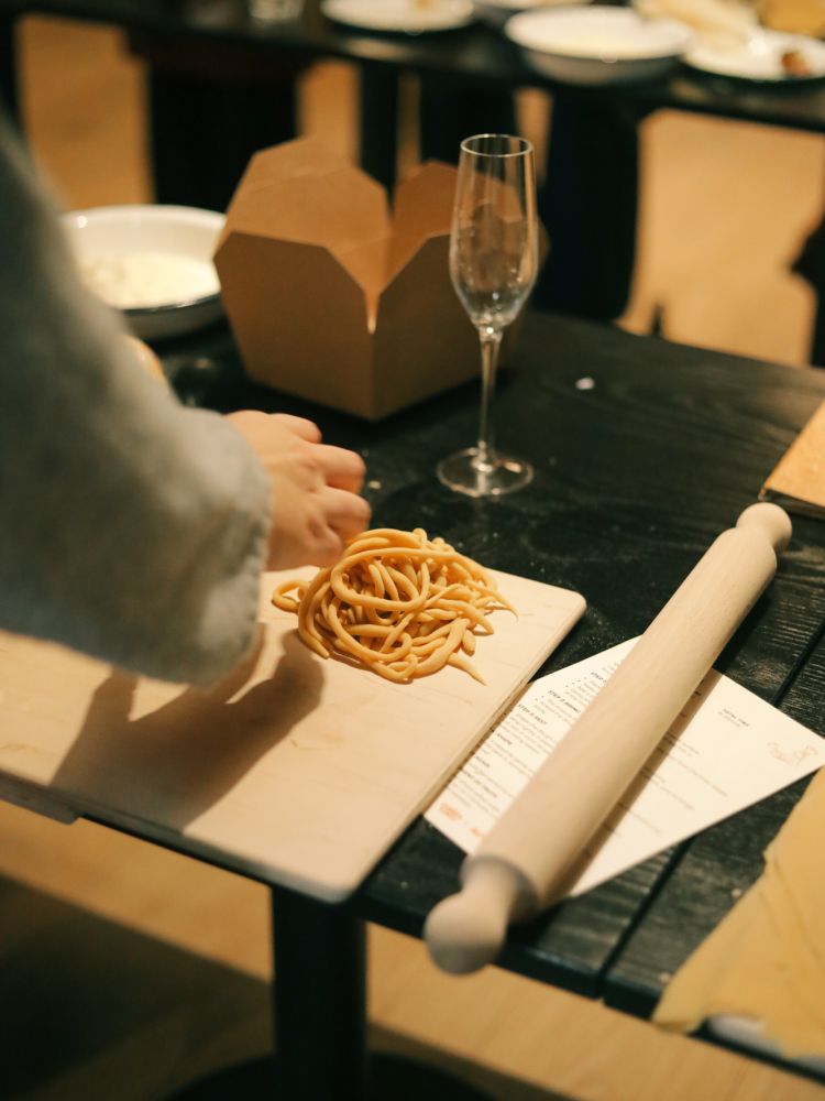 Making pasta shapes at pasta making class