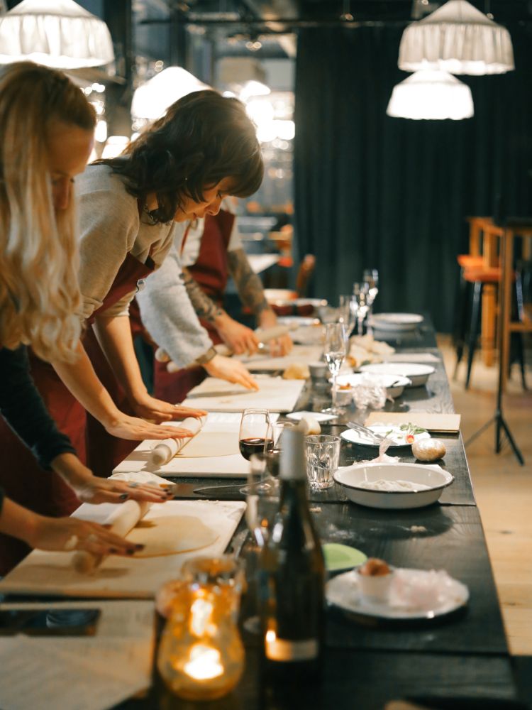 Rolling pasta dough at pasta making class