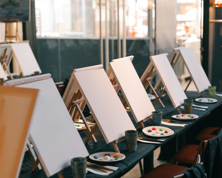 Painting materials set up on tables