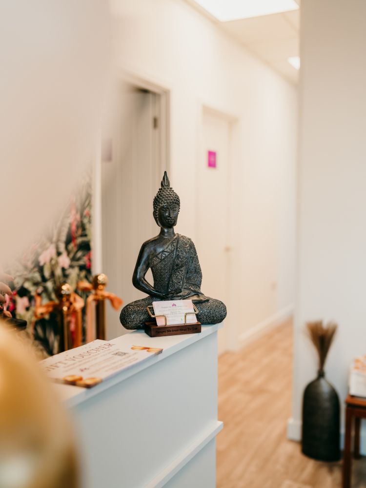 reception desk of wellness studio in woking with buddha statue
