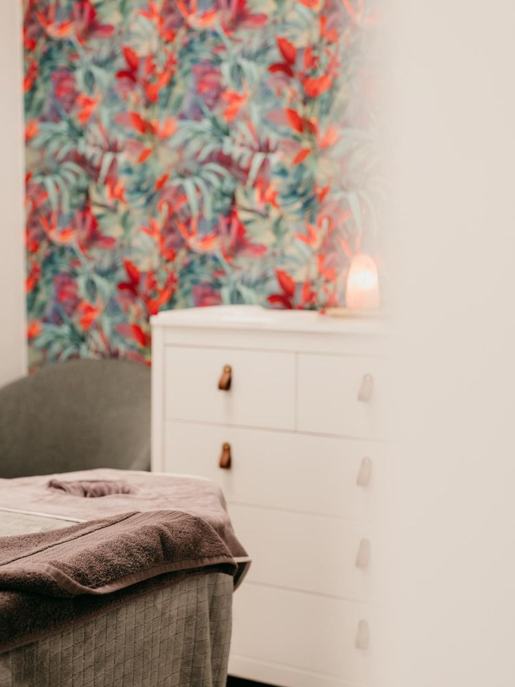 treatment room with bright wallpaper