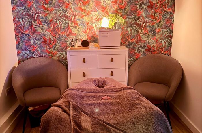 massage treatment room with massage bed for pamper session