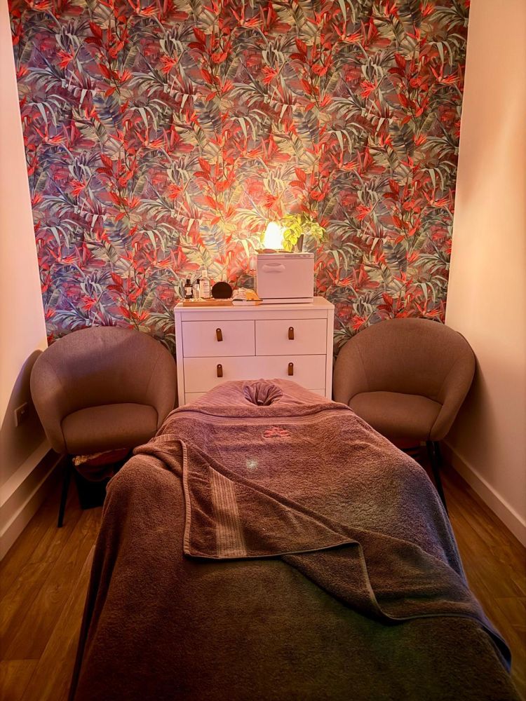 massage treatment room with massage bed for pamper session