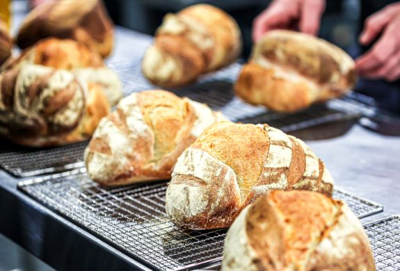 sourdough loaves on cooling racks made on sourdough bread making experience