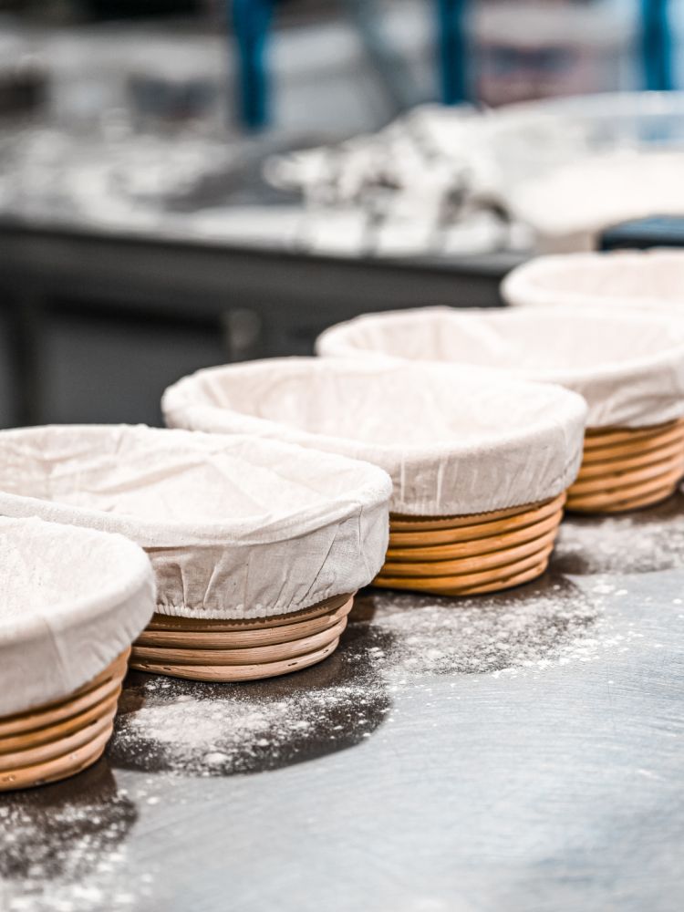 row of sourdough bread baskets used on a bread making experience