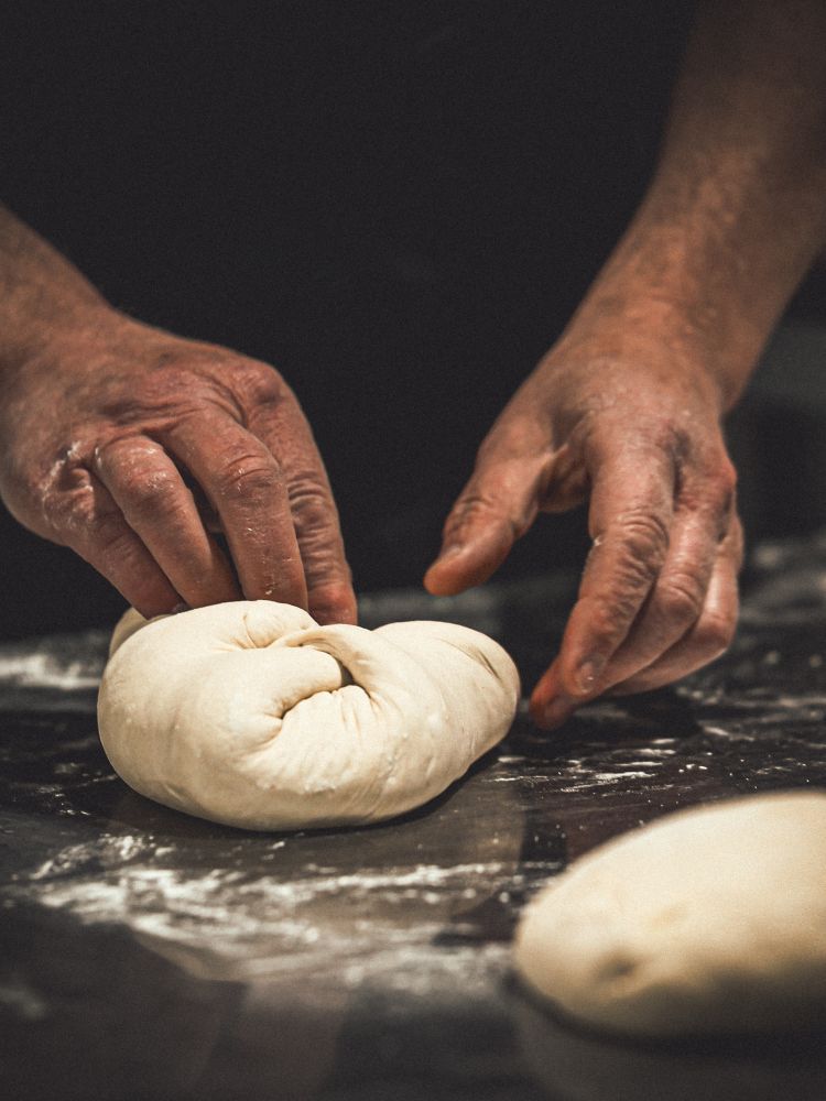 kneading sourdough bread dough on bread making course