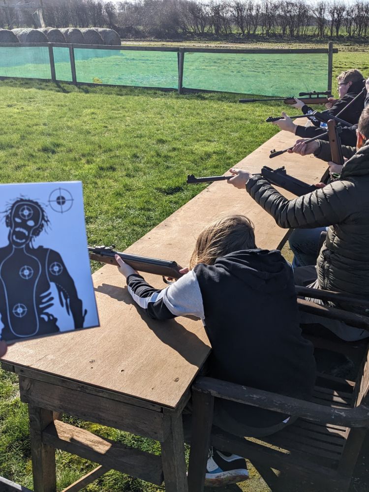 people shooting at zombie targets on a zombie apocalypse weapons training experience