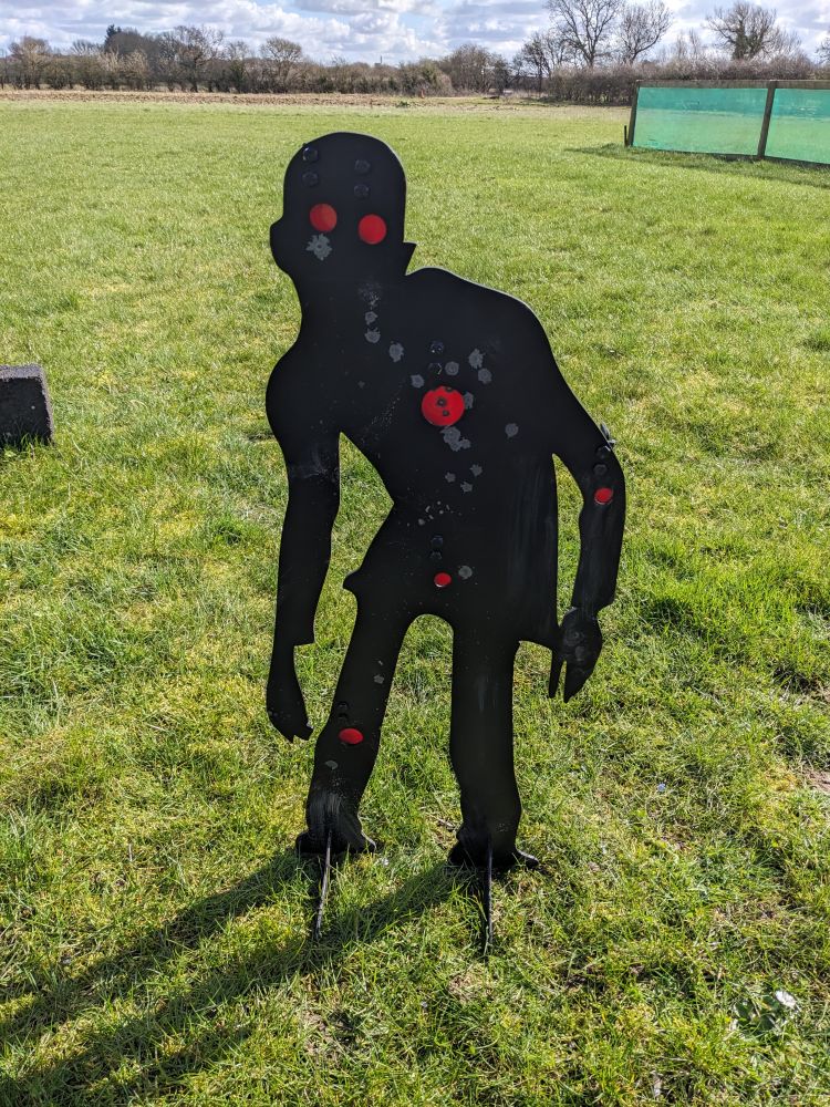 a black zombie shaped shooting target on a zombie apocalypse weapons training experience
