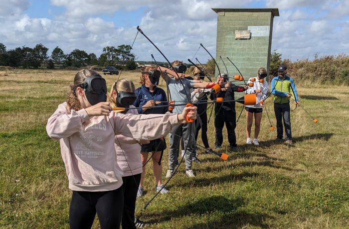 group shooting arrows on combat archery experience